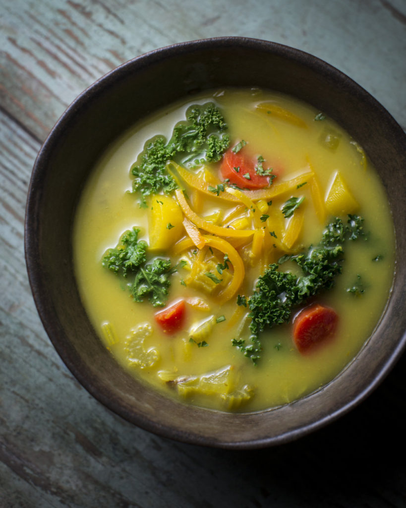This immune boosting soup has a wholesome, brothy, filled with spicy ginger and large chunks of vegetables floating in a golden turmeric broth.