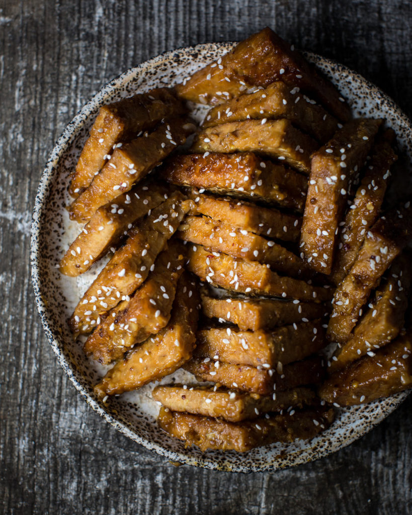 This apricot glazed tempeh recipe is absolutely perfect! Glaze is sweet, tangy, and savory, with just a kick of spice. The texture of the tempeh is firm yet tender with a delightful crunch.