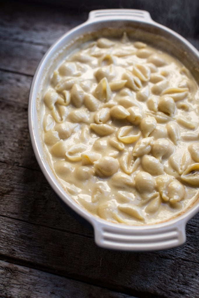 White bowl filled with creamy white truffle mac and cheese