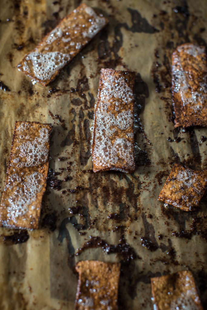 Tofu bacon after the oven on parchment paper