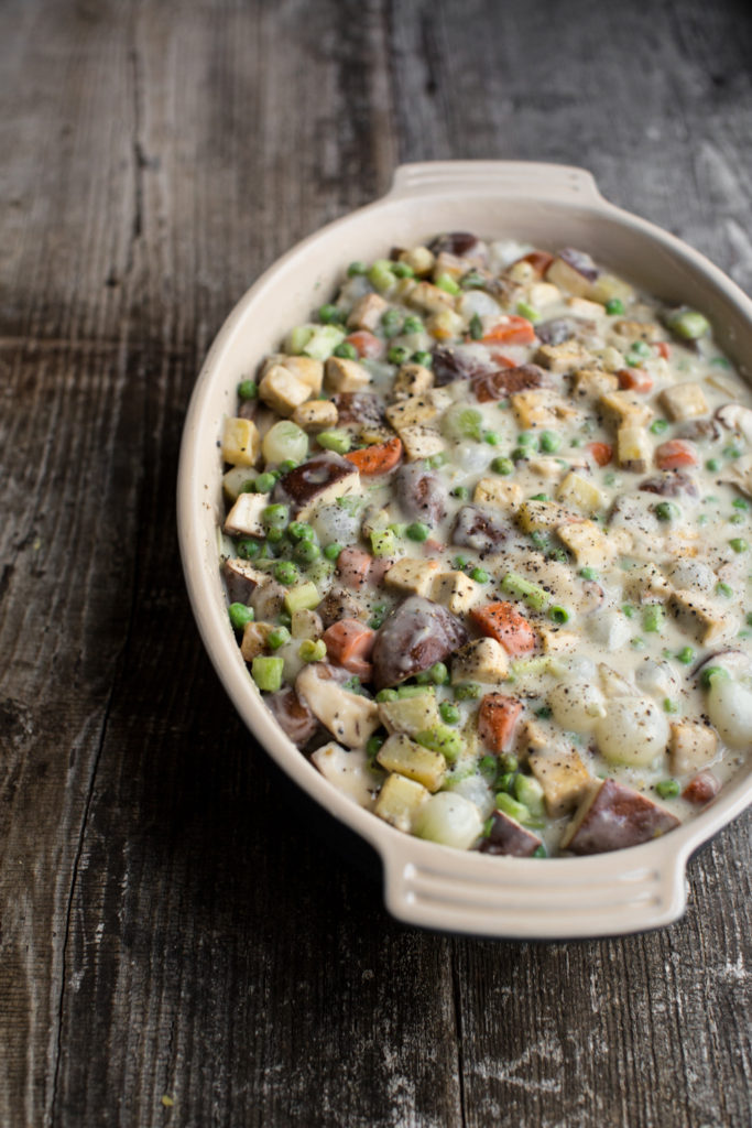 This tofu vegetable biscuit pot pie has rich and creamy gravy, bright green peas, delightfully chewy cubes of roasted tofu, and an assortment of veggies!