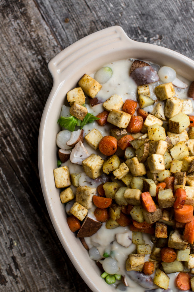 This tofu vegetable biscuit pot pie has rich and creamy gravy, bright green peas, delightfully chewy cubes of roasted tofu, and an assortment of veggies!