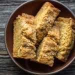 cheddar garlic beer bread sliced in a bowl
