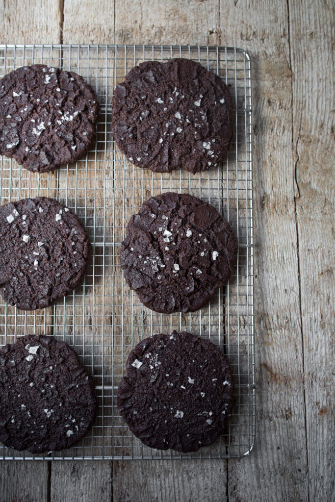 Salted Dark Chocolate Olive Oil Cookies cooling on a wire baking rack