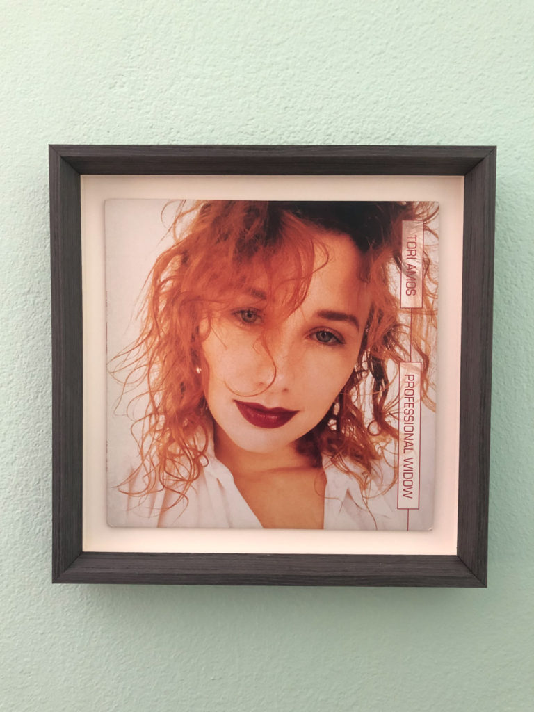 framed Tori Amos record hanging on a wall