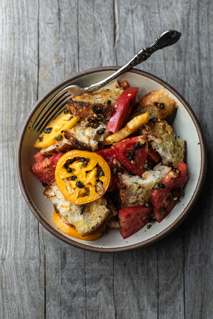 Bowl of fried caper panzanella