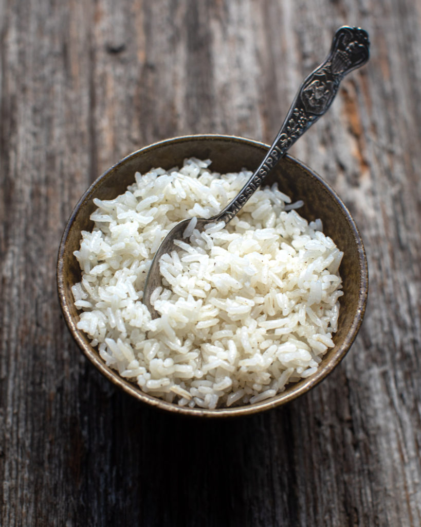 Easy baked rice in a bowl with a spoon