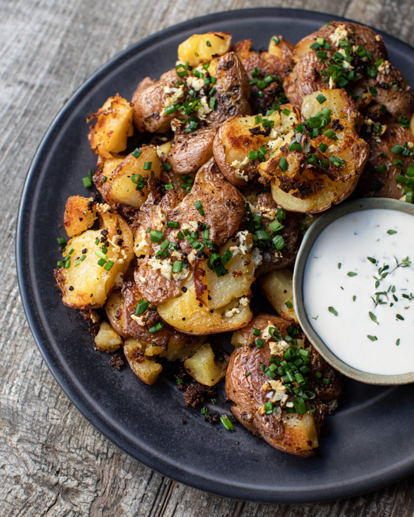 Crispy crawtators on a plate with meyer lemon aioli