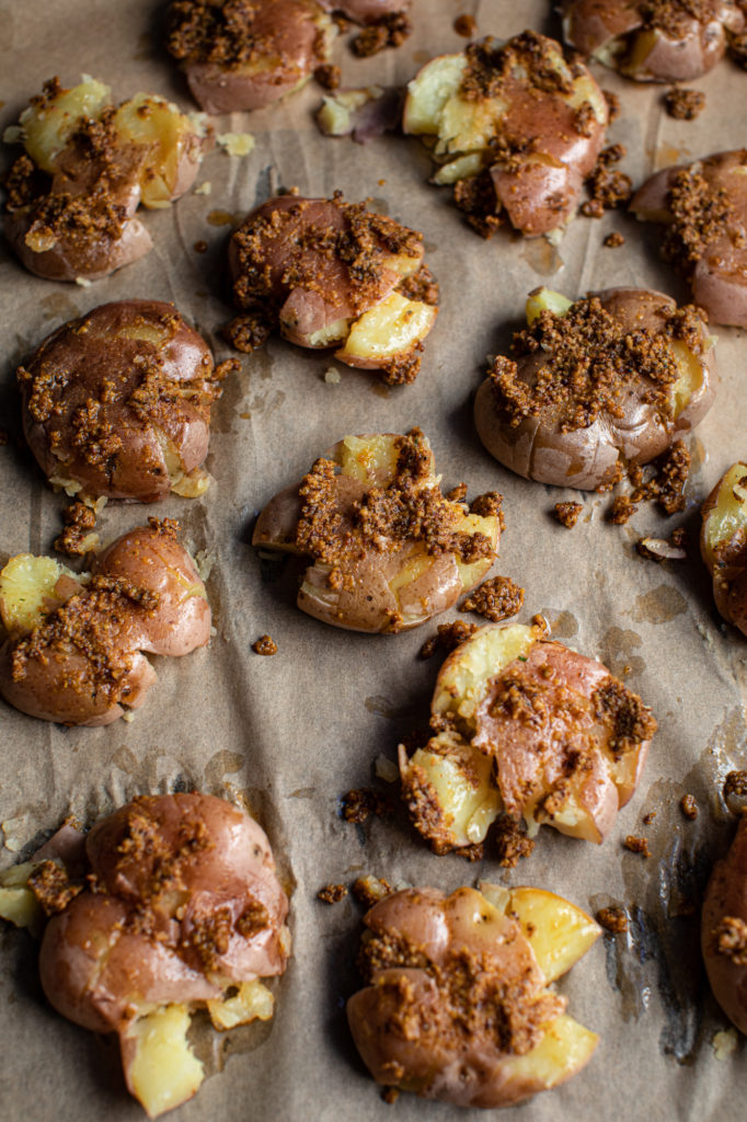 Crispy crawtators on parchment paper before baking