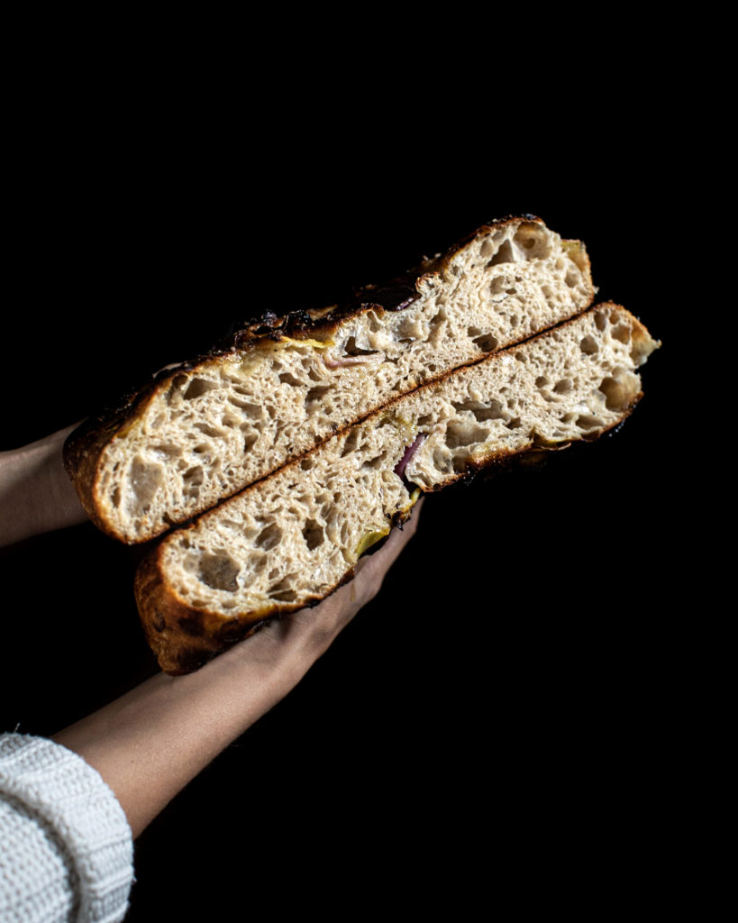 Two pieces of sourdough focaccia