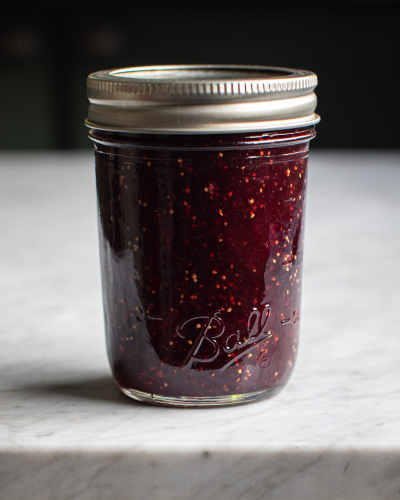 Glass jar of fig rosemary & red wine jam