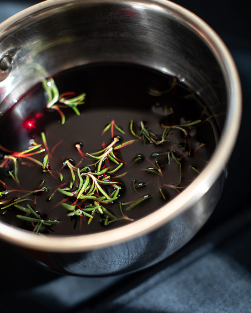 fig rosemary & red wine jam simmering in a pot