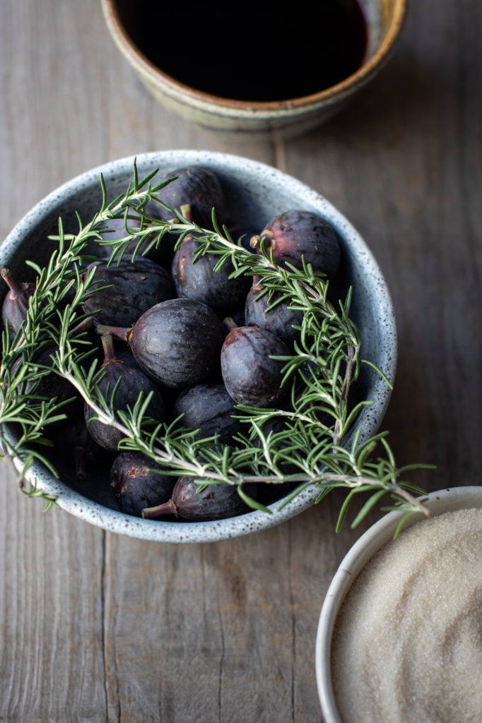 Figs and rosemary in a blue bowl