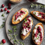 cranberry mustard spread on baguettes on a serving plate