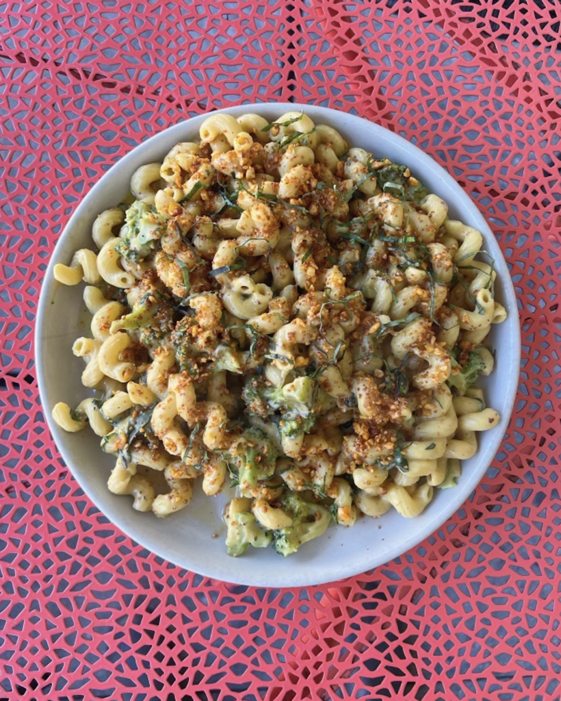 Plate of macaroni and cheese on a red table