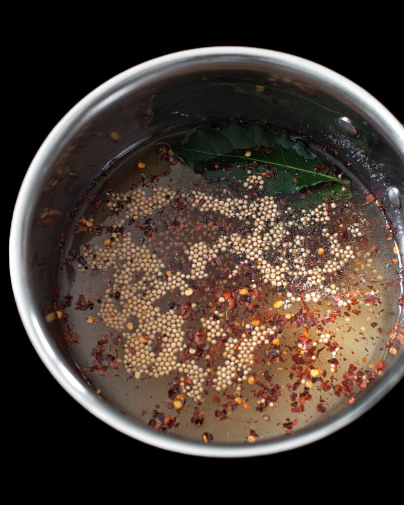 Brine for sweet pickled radish in a pot