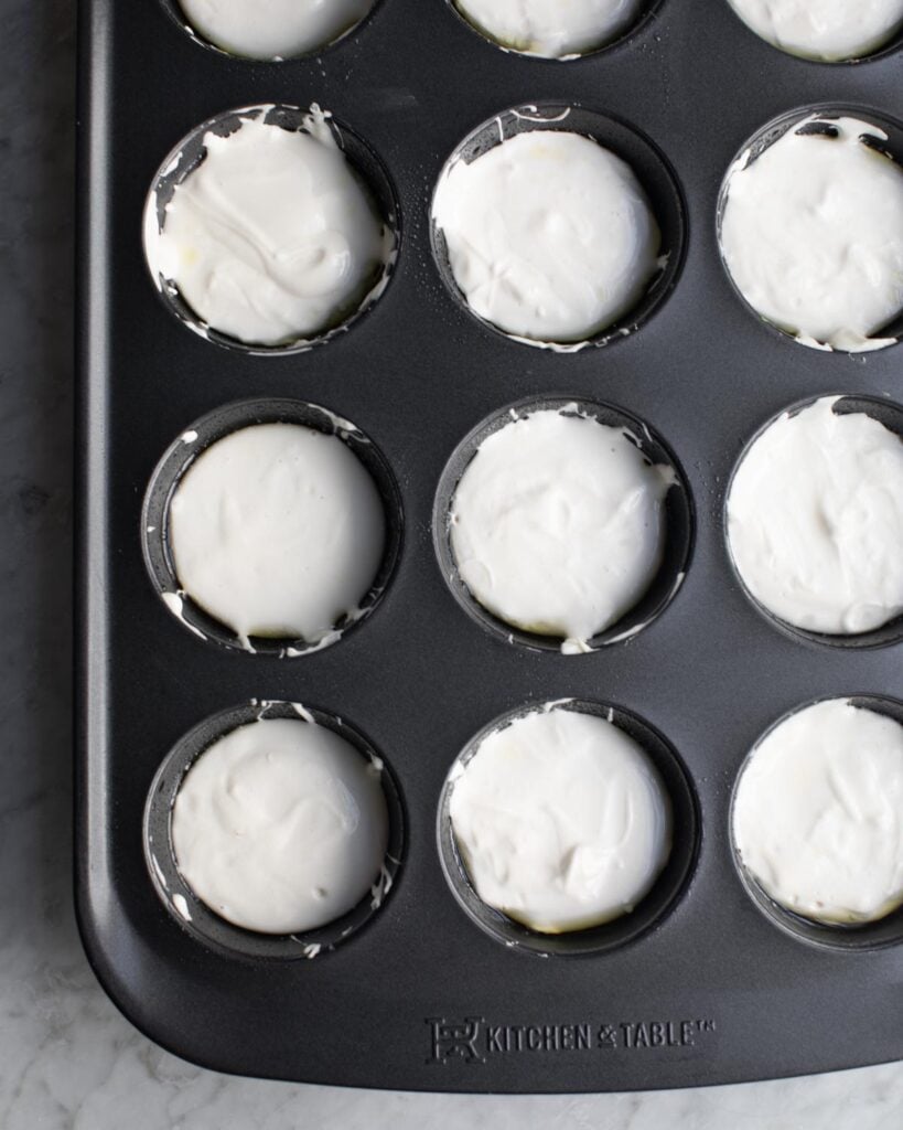 filled muffin pan with dinner roll batter