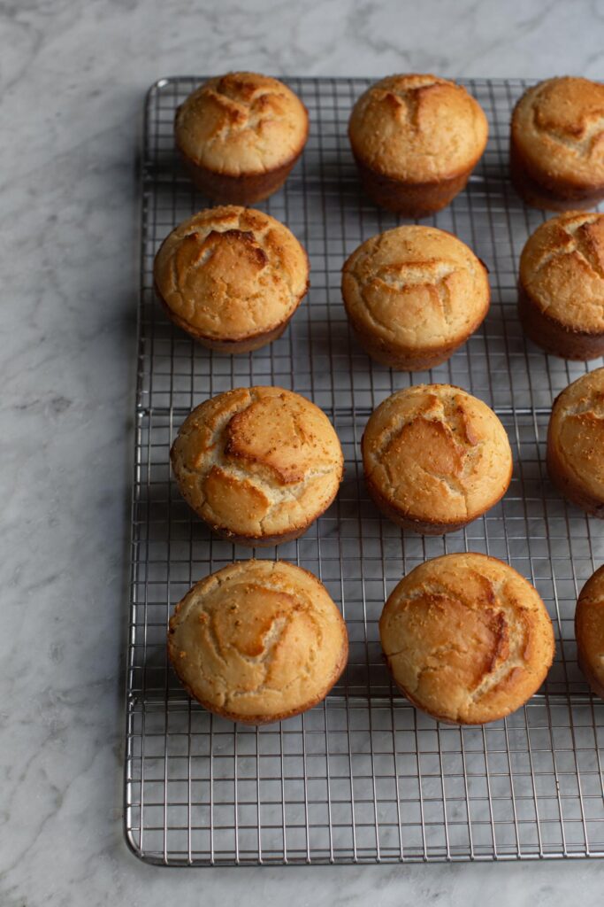 Baked dinner rolls cooling on a wire rack