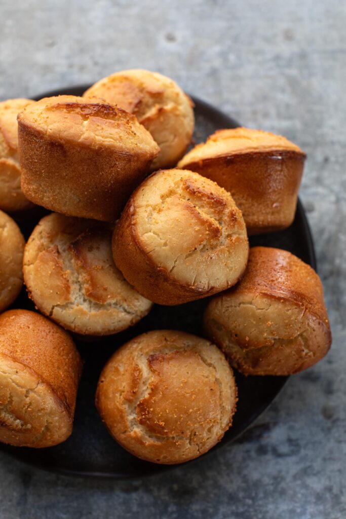 Incredible gluten free dinner rolls piled on a plate
