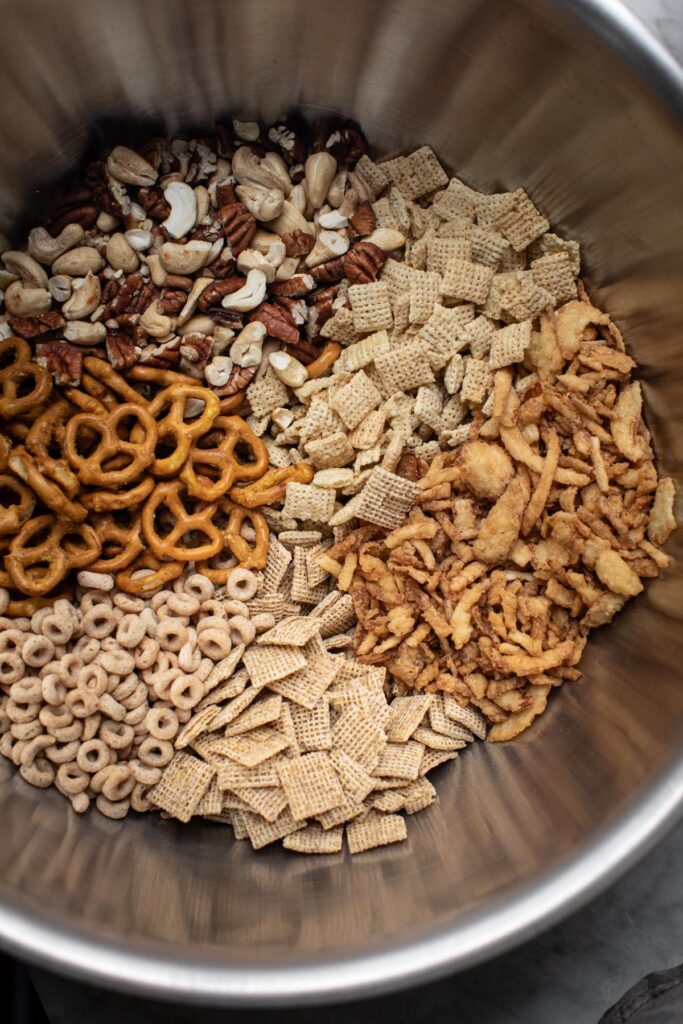 Ingredients for creole chex mix in a bowl