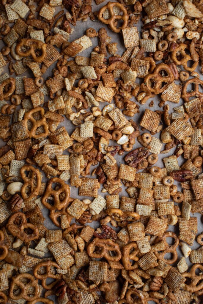 Creole chex mix on a baking sheet