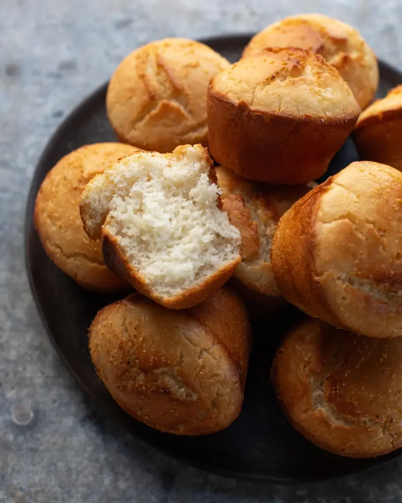 Pile of gluten free dinner rolls on a plate - a must-try vegan holiday recipe!