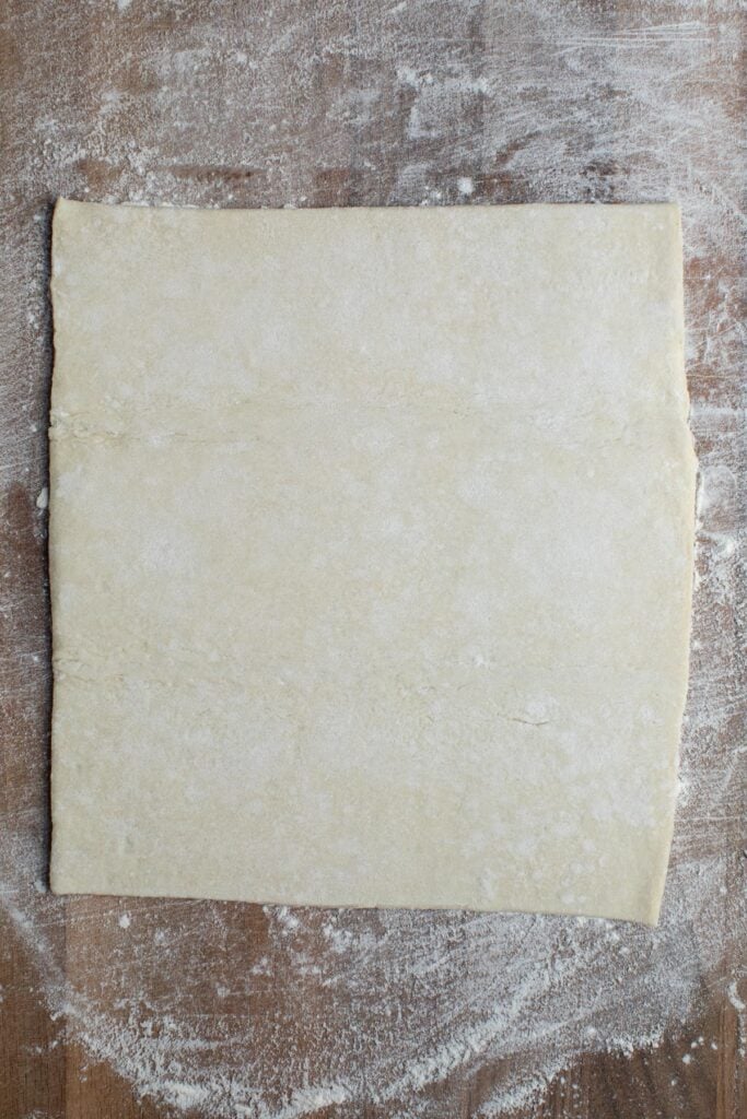 rolled dough on cutting board