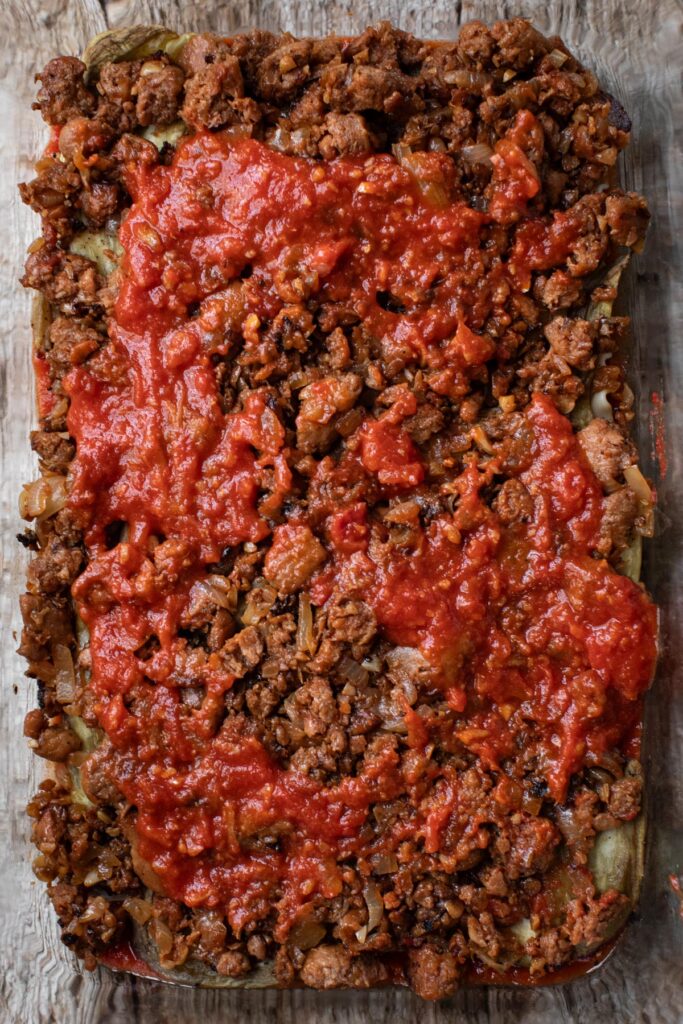 Plant-based meat layer in a baking dish. 