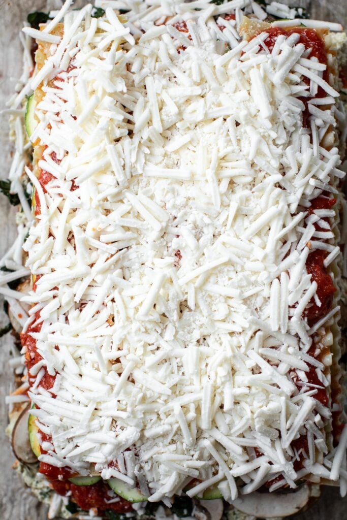 Plant-based cheese layer in a baking dish for epic lasagna