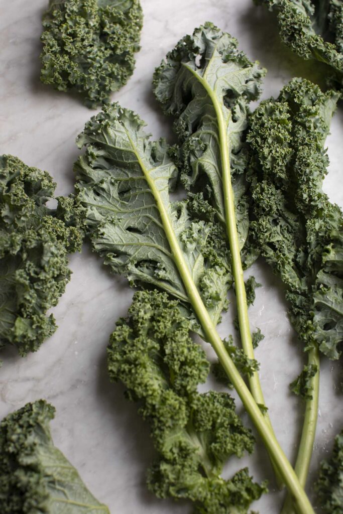 kale leaves on marble
