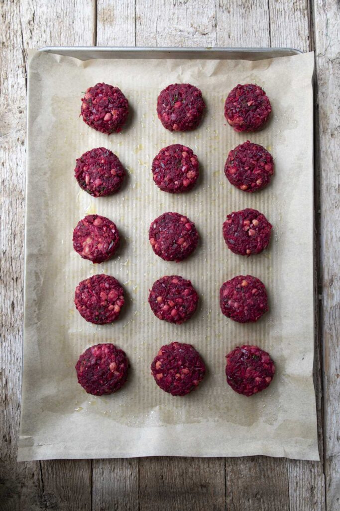 shaped vegetable cakes on a baking sheet 