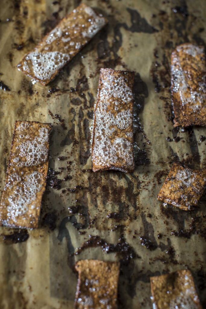 tofu bacon frying in the oven