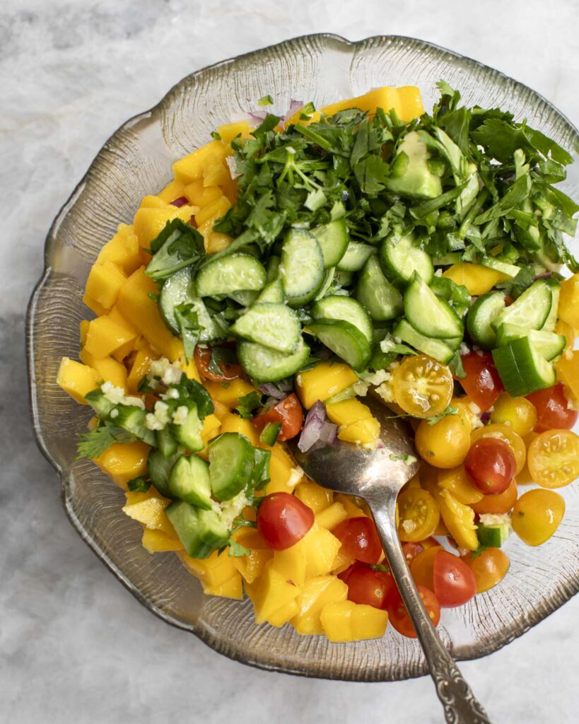 ingredients being mixed in a bowl with a spoon