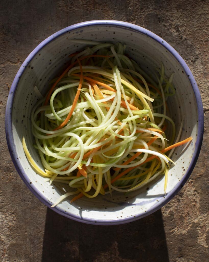 the undressed vegetables in a bowl