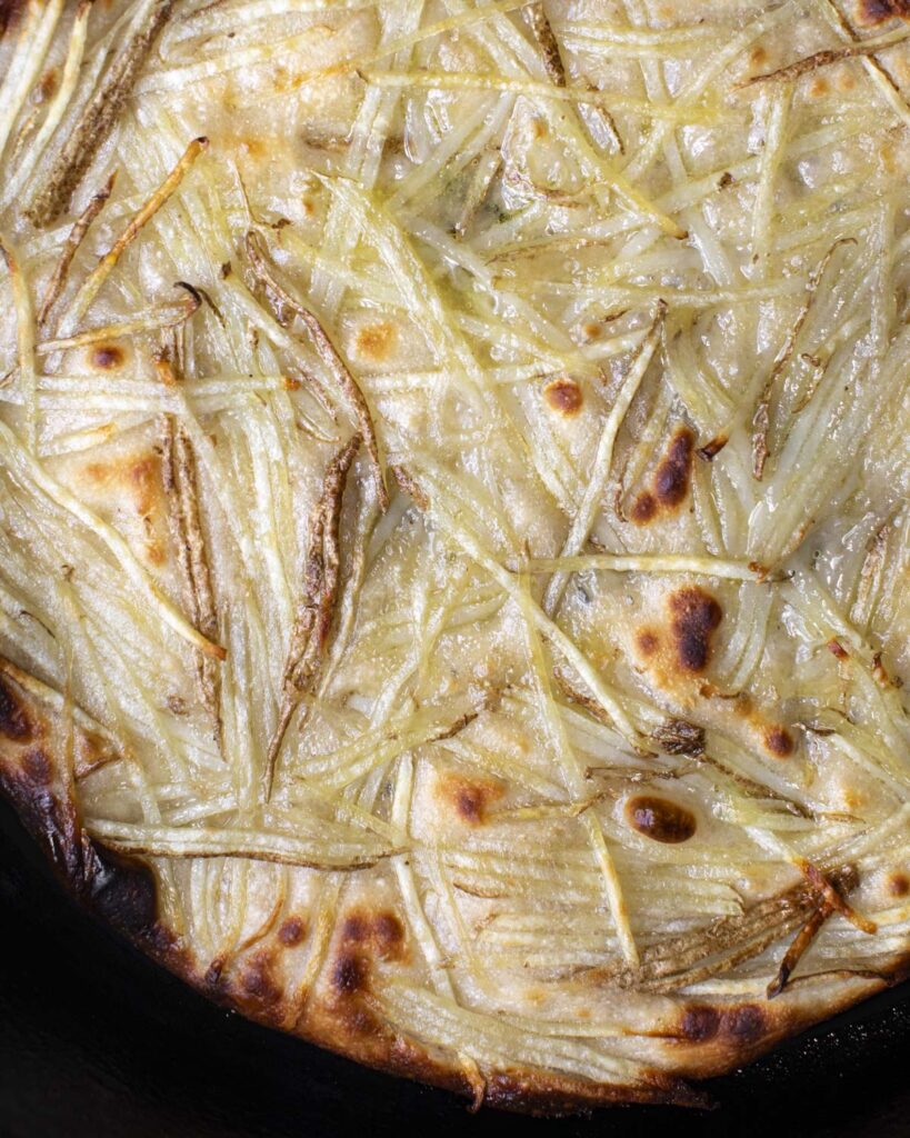 final baked focaccia genovese in a skillet