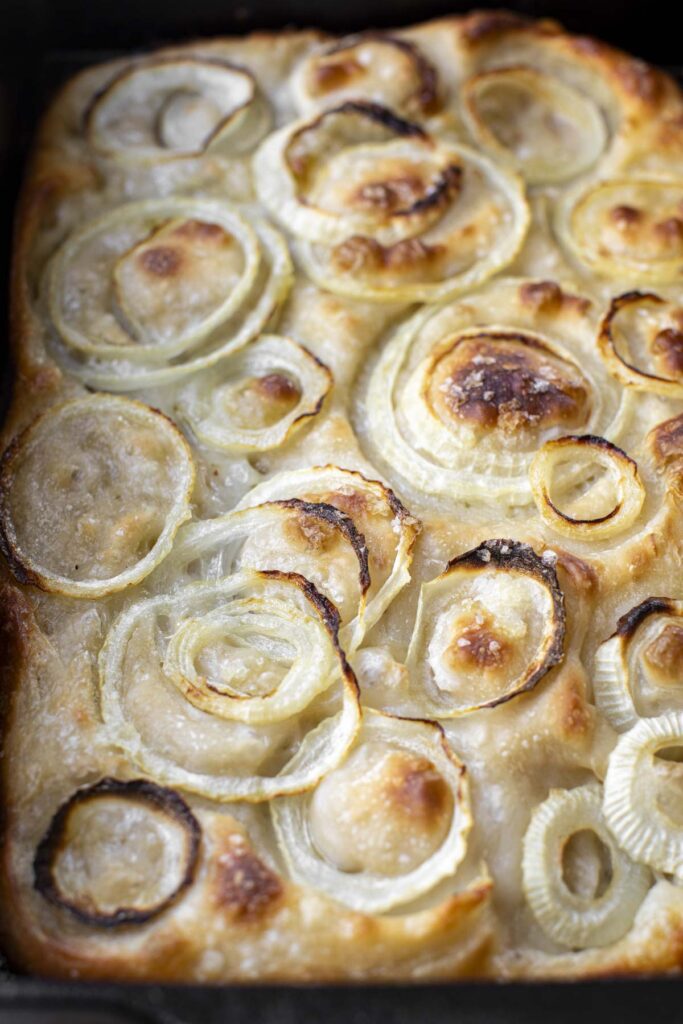 focaccia genovese with onions in a baking dish