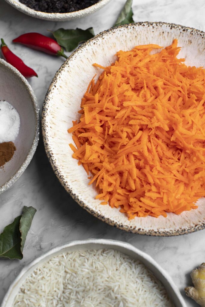 Shredded carrots and other ingredients on a table