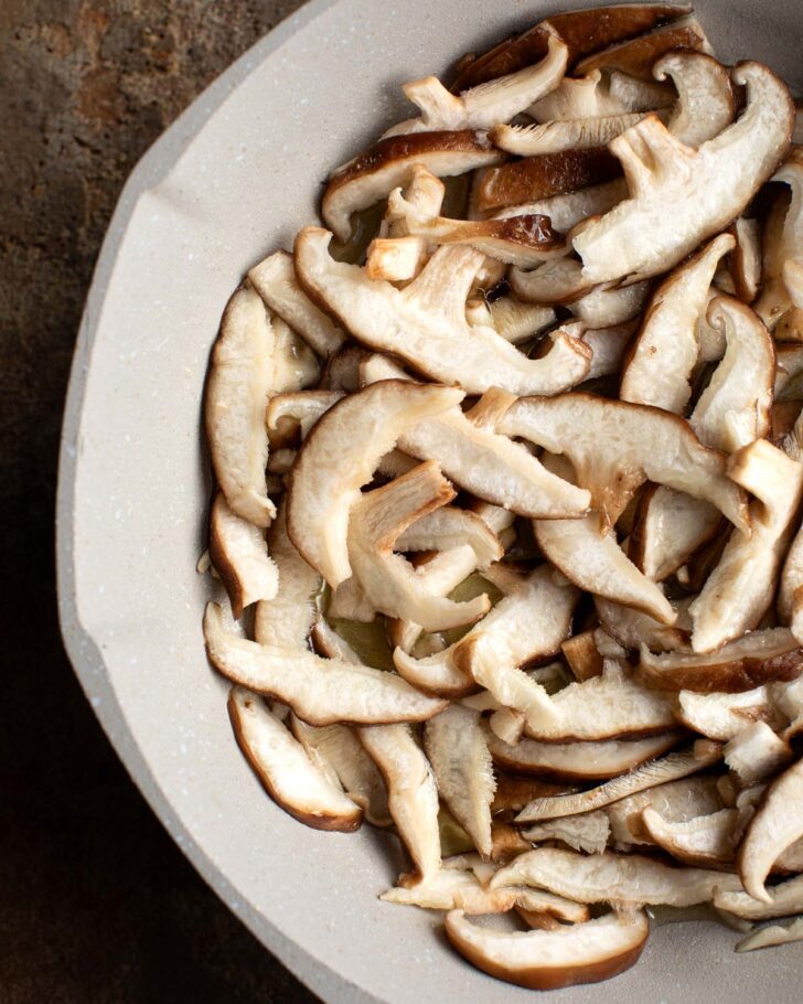 shiitake mushrooms sliced and in a pan