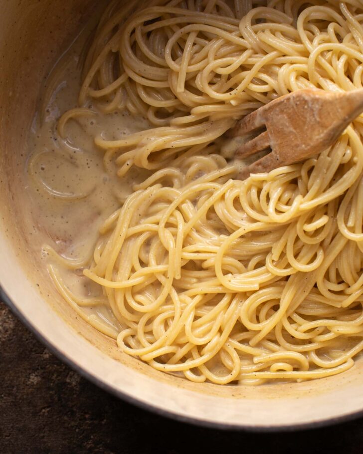 noodles absorbing the sauce in the pot