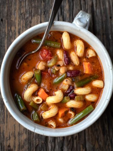 vegan minestrone in a bowl with a spoon