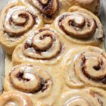 vegan orange cinnamon rolls in a baking dish