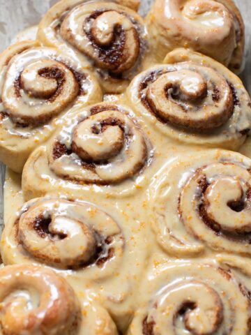 vegan orange cinnamon rolls in a baking dish