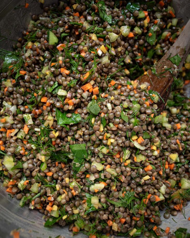 lentil salad ingredients combined in a large bowl