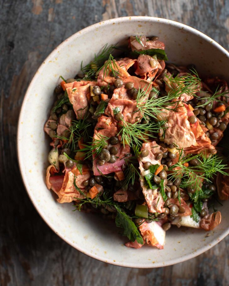 lentil salad combined with radicchio leaves in a bowl