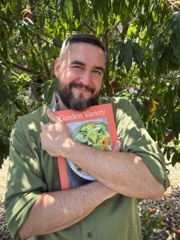 timothy pakron holding his new cookbook garden variety