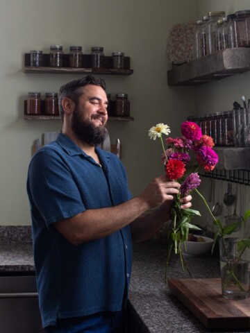 timothy pakron in the kitchen with flowers